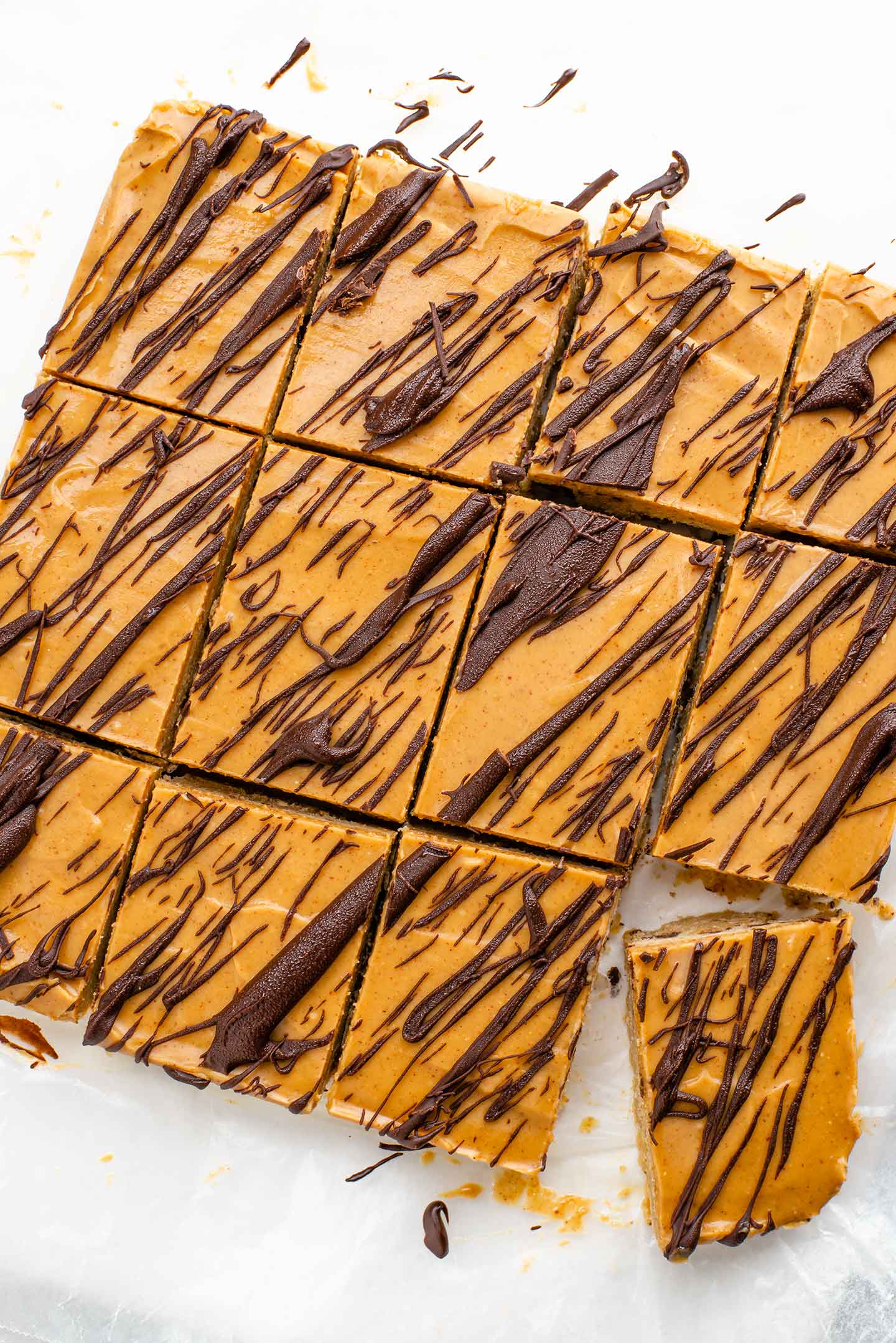 Top down view of the finished frozen  bars drizzled in dark chocolate and sliced into 12 individual bars.