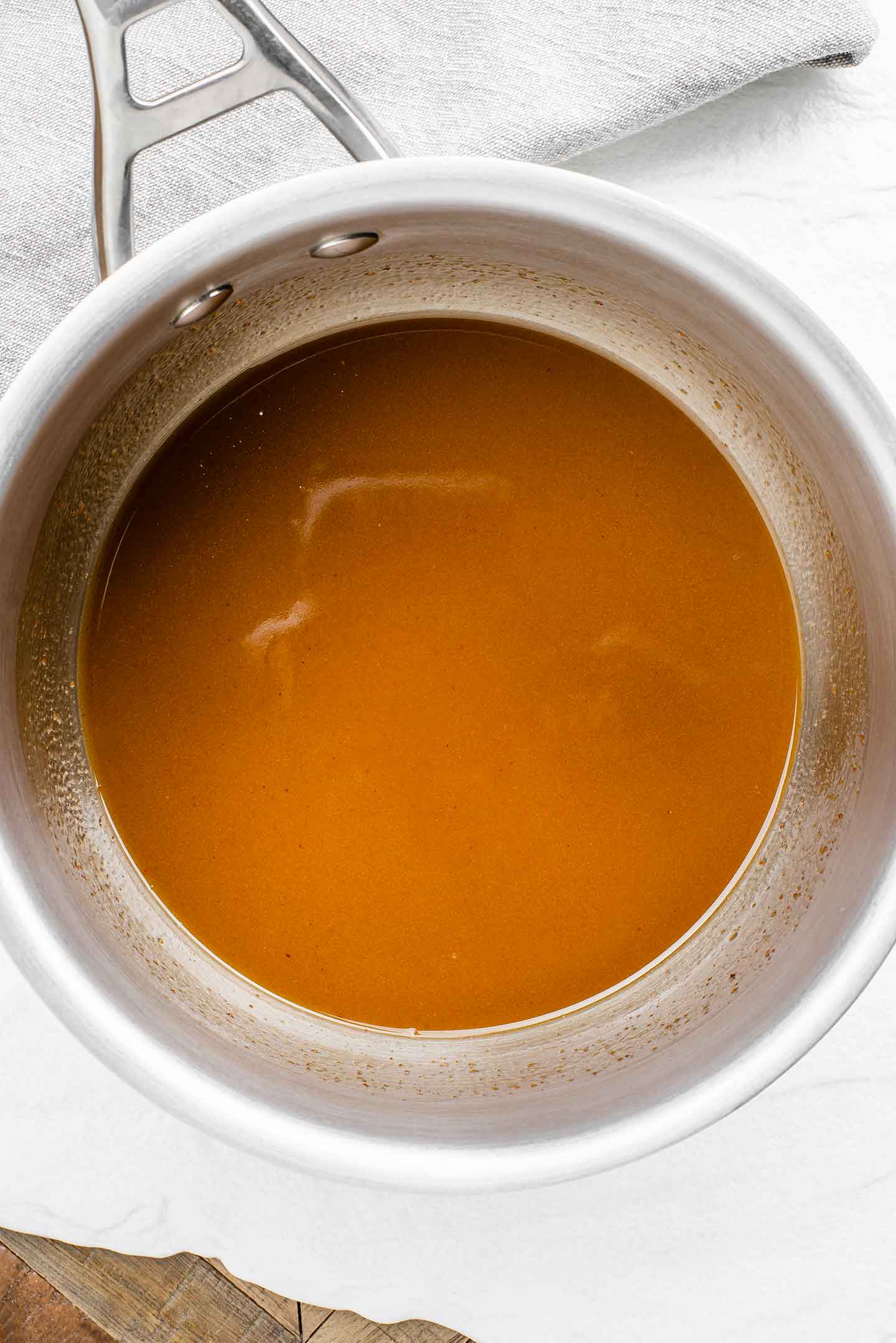 Top down view of a melted seasoning mixture in a small pot.