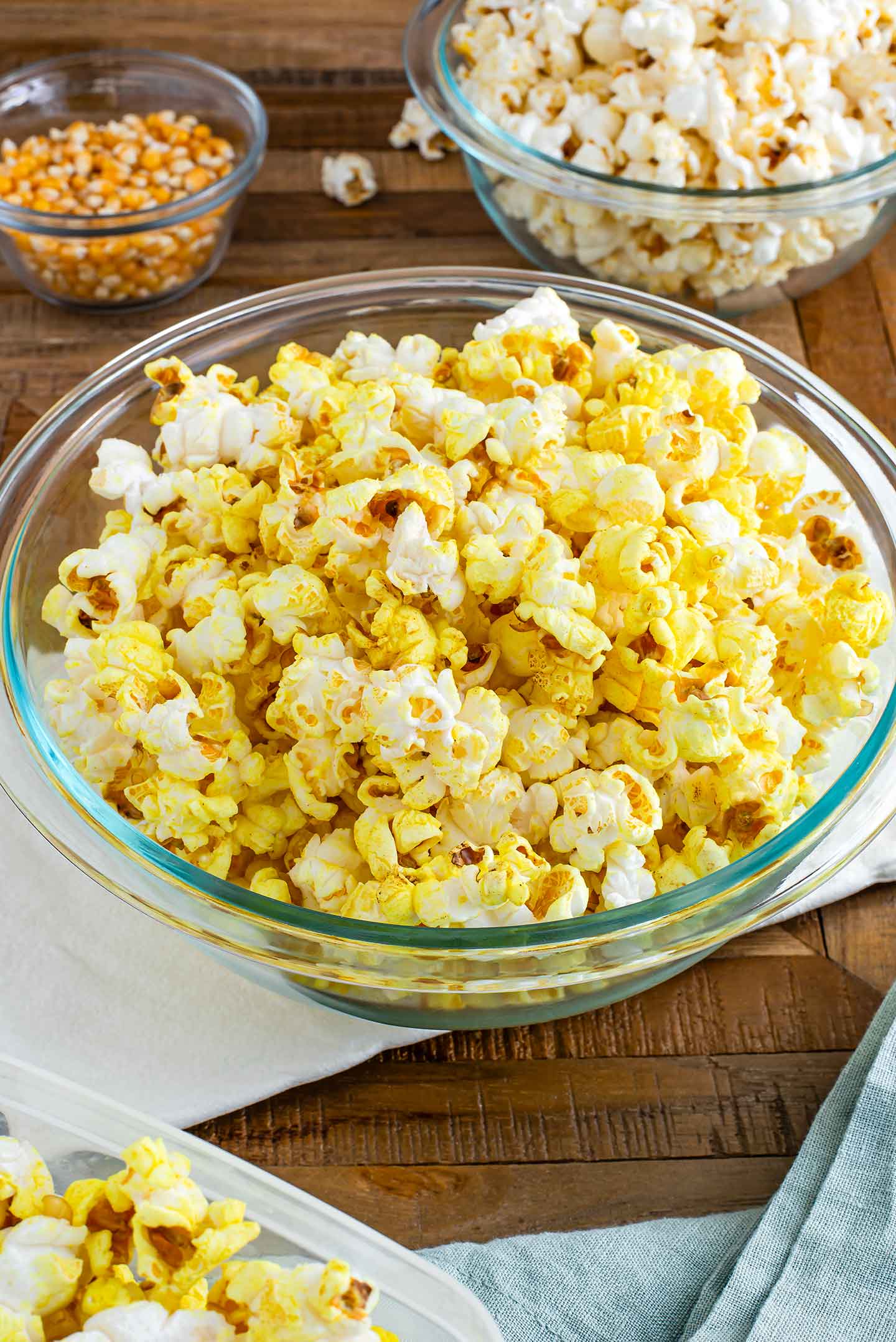 Side view of turmeric seasoned popcorn in a large bowl.