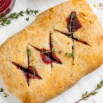 Top down view of a vegan beet wellington with golden pastry.