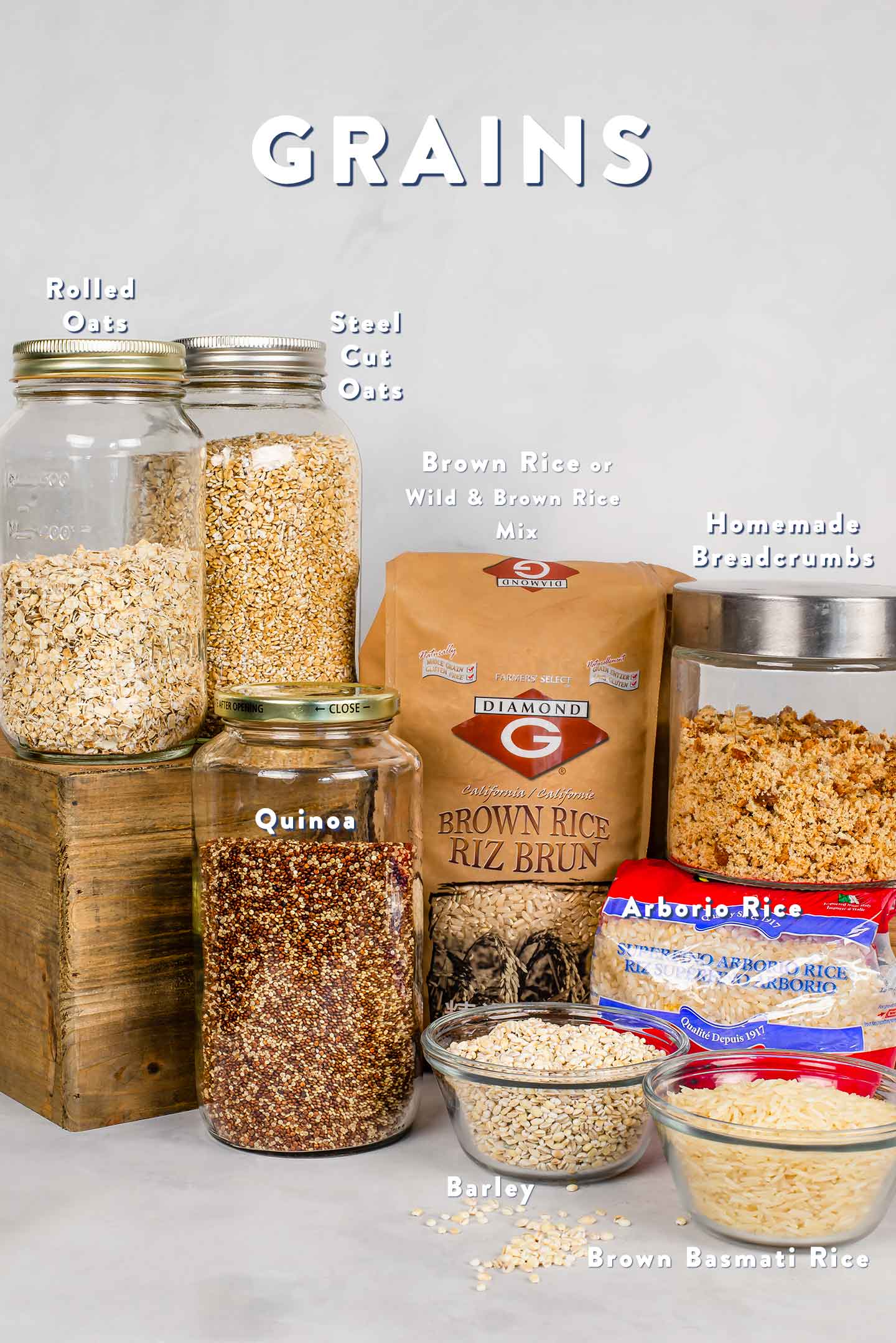 A grouping of grains including oats, quinoa, brown rice and breadcrumbs.