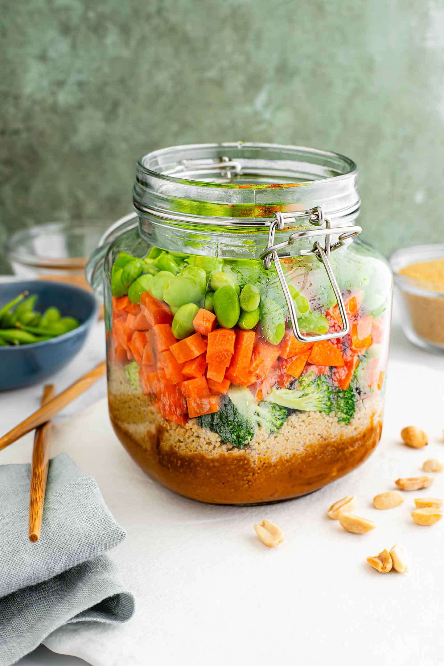 Water hydrates the couscous in a pour-over salad served in a glass jar. The couscous visibly fluffs up as it rehydrates.