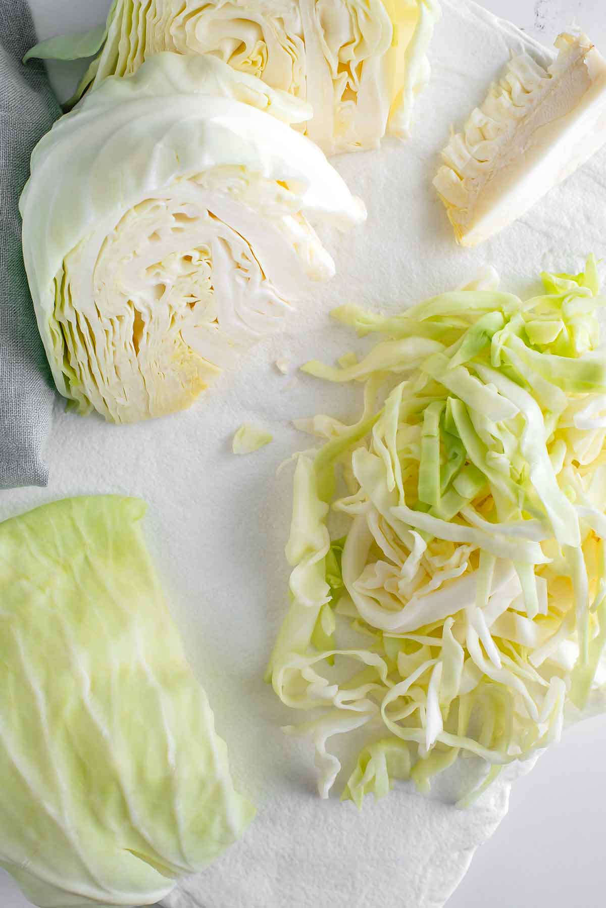 Top down view of taiwanese flat cabbage quartered and shredded.